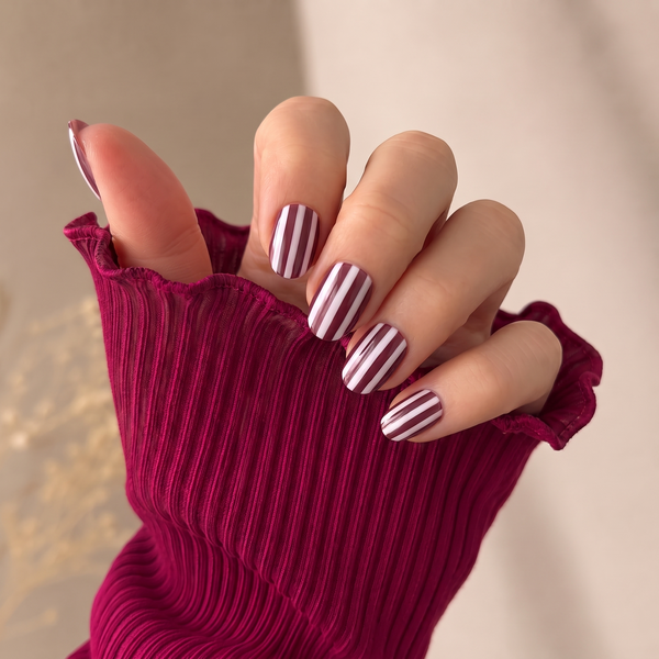Sugar Stripes press-on nails — worn lifestyle hero