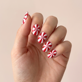 Candy Cane press-on nails — worn lifestyle hero