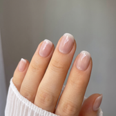 Ghost Veil press-on nails — glossy fingertip close-up
