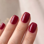 Sour Cherry press-on nails — glossy fingertip close-up