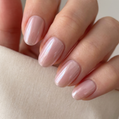 Bella press-on nails — glossy fingertip close-up