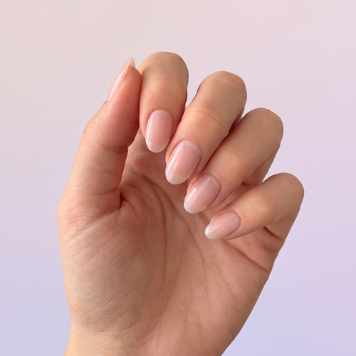 Bare Minimum press-on nails — styled hand angle