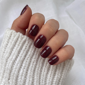 Sour Grape press-on nails — glossy fingertip close-up
