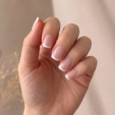 Madam press-on nails — styled hand angle