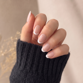 Madeleine press-on nails — styled hand angle