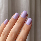 Lavender Haze press-on nails — glossy fingertip close-up