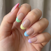 Sunny press-on nails — glossy fingertip close-up