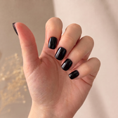 Jet press-on nails — styled hand angle