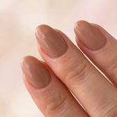 Butterscotch press-on nails — glossy fingertip close-up