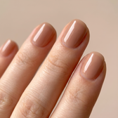 Brulee press-on nails — glossy fingertip close-up