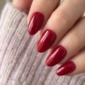 Sour Cherry press-on nails — glossy fingertip close-up