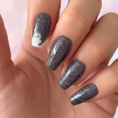 Phantom press-on nails — glossy fingertip close-up