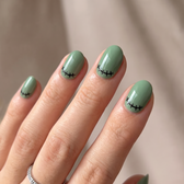 Monster Mash press-on nails — glossy fingertip close-up