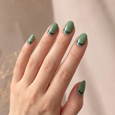Monster Mash press-on nails — styled hand angle