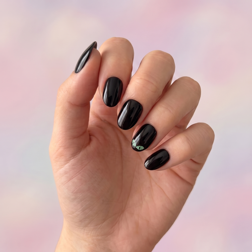 Black Cat press-on nails — styled hand angle
